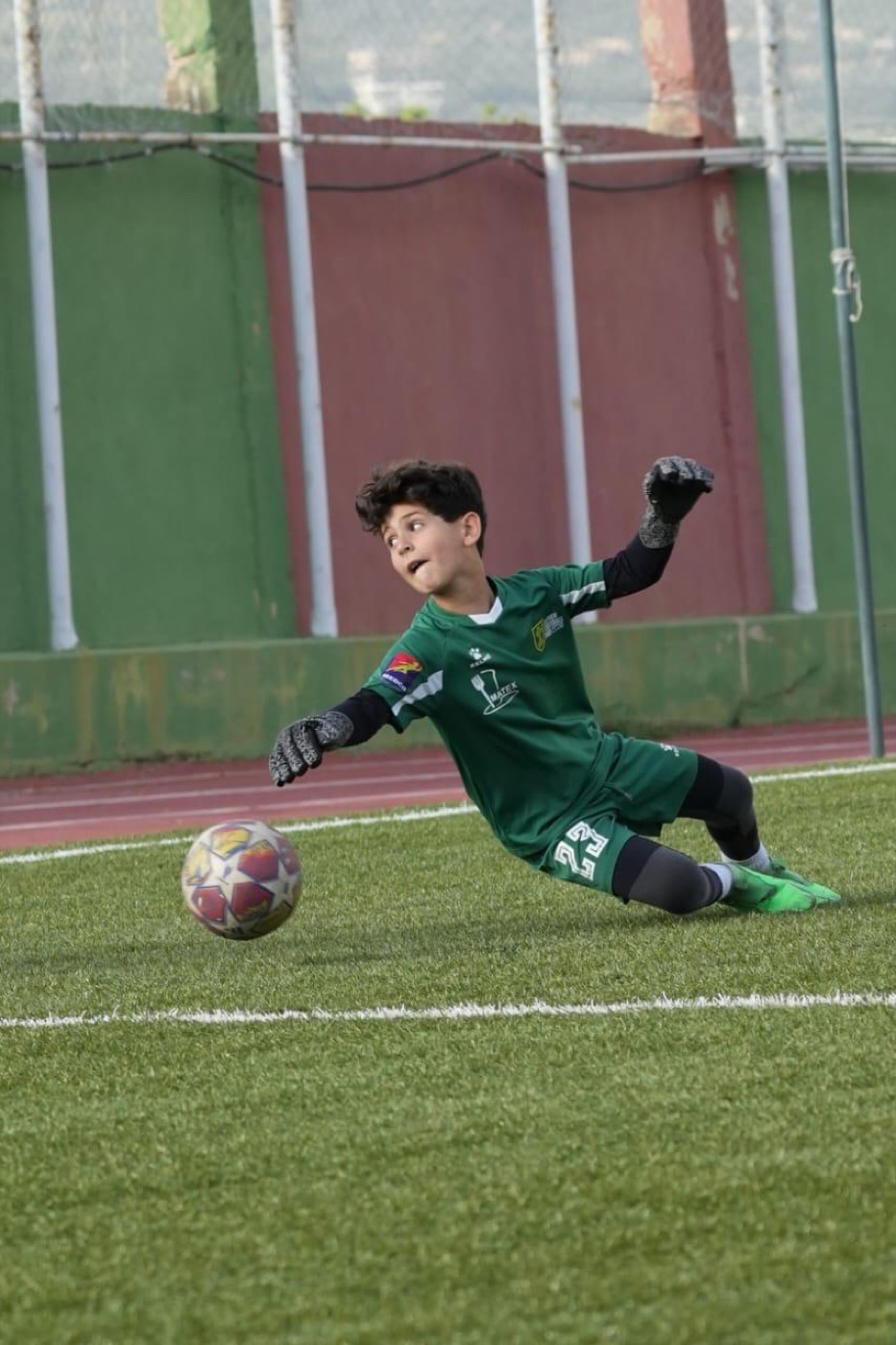 Lucas in full stretch making a fingertip save
