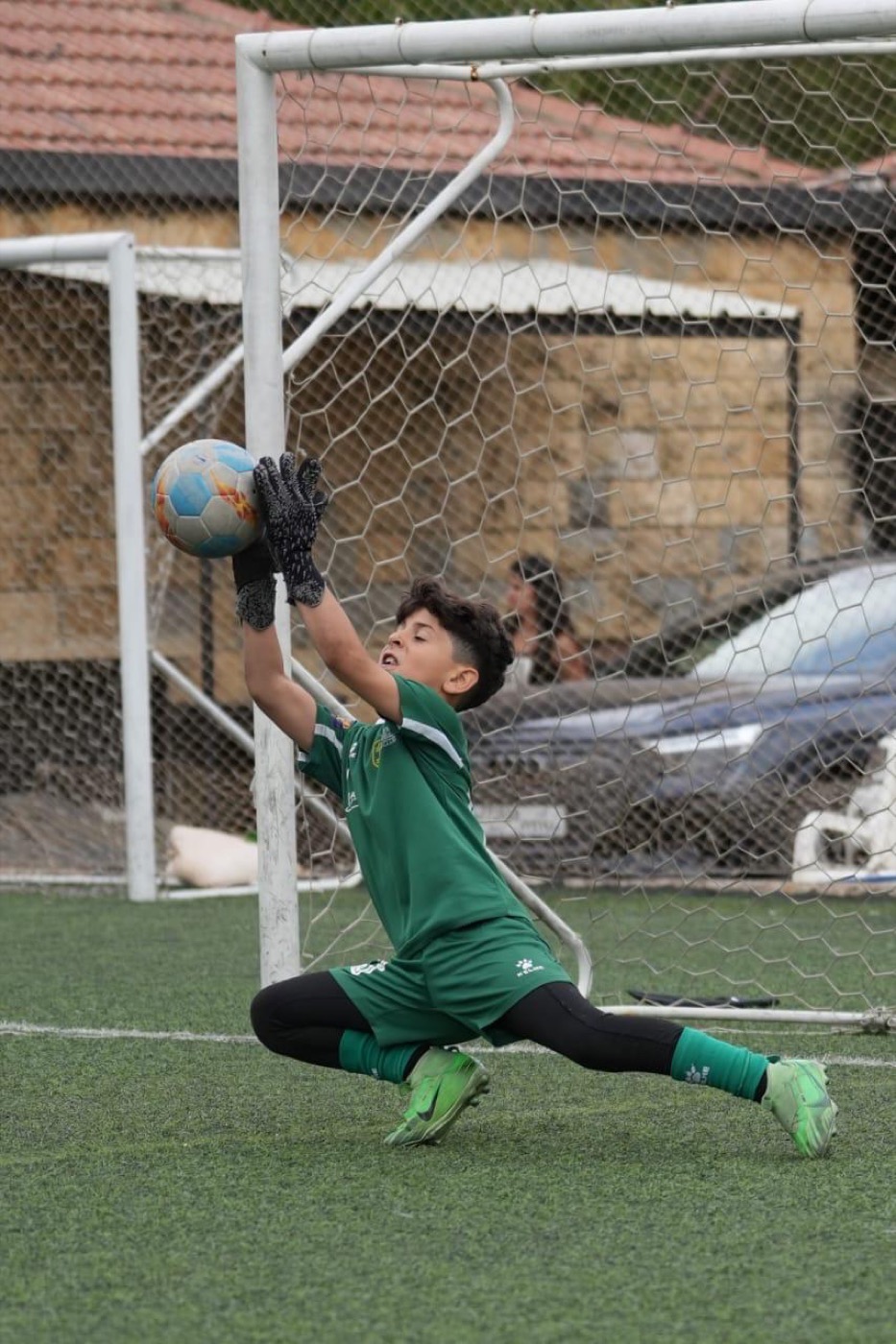 Lucas diving to his left to make a save