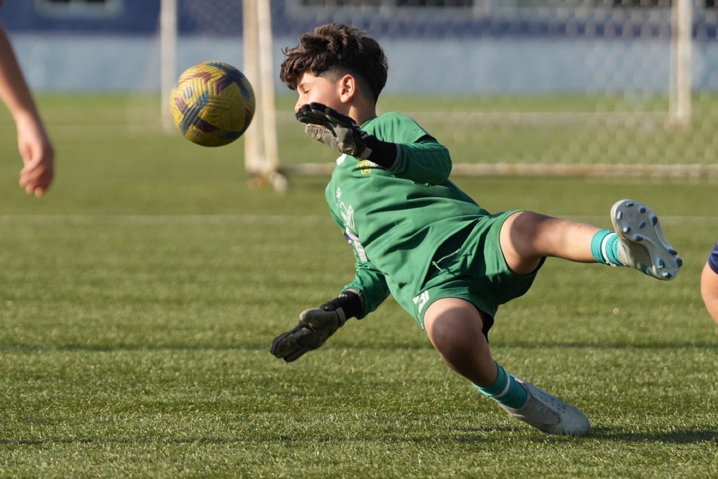 Lucas showing off his goalkeeper gloves off the pitch